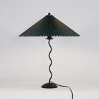 Squiggle table lamp showing the curvy sculptural stem