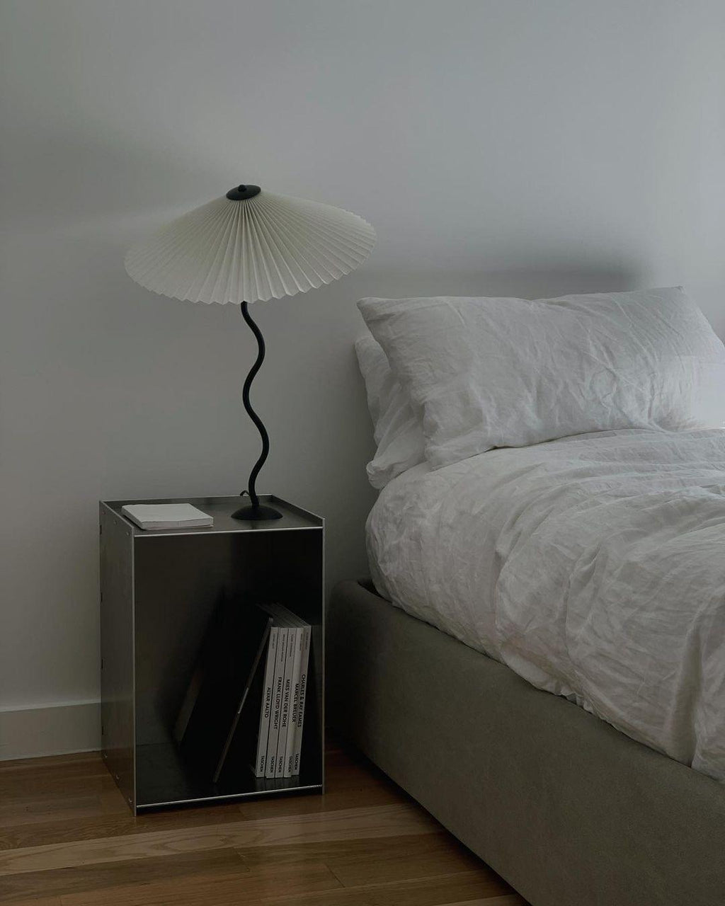 Squiggle table lamp with wavy black base detail