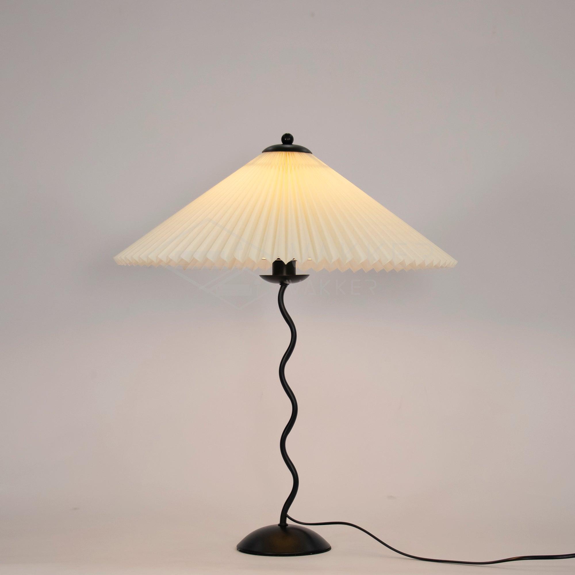 Squiggle table lamp with beige pleated shade and wavy black stem