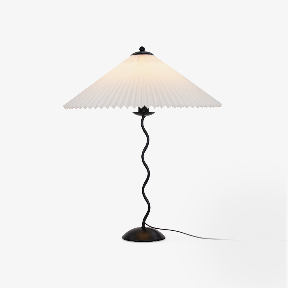 Squiggle table lamp with sculptural stem in a styled corner