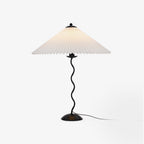 Squiggle table lamp with sculptural stem in a styled corner