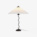 Squiggle table lamp with wavy stem on a console