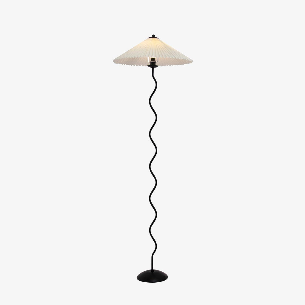 Squiggle floor lamp showing full silhouette against a wall
