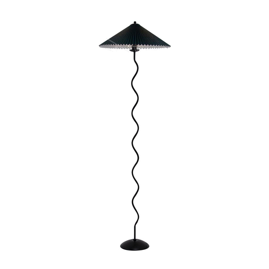 Wavy black metal base of the Squiggle floor lamp in close detail