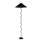 Squiggle floor lamp beside an armchair with warm glowing shade