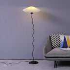 Squiggle floor lamp with wavy black stem and pale shade