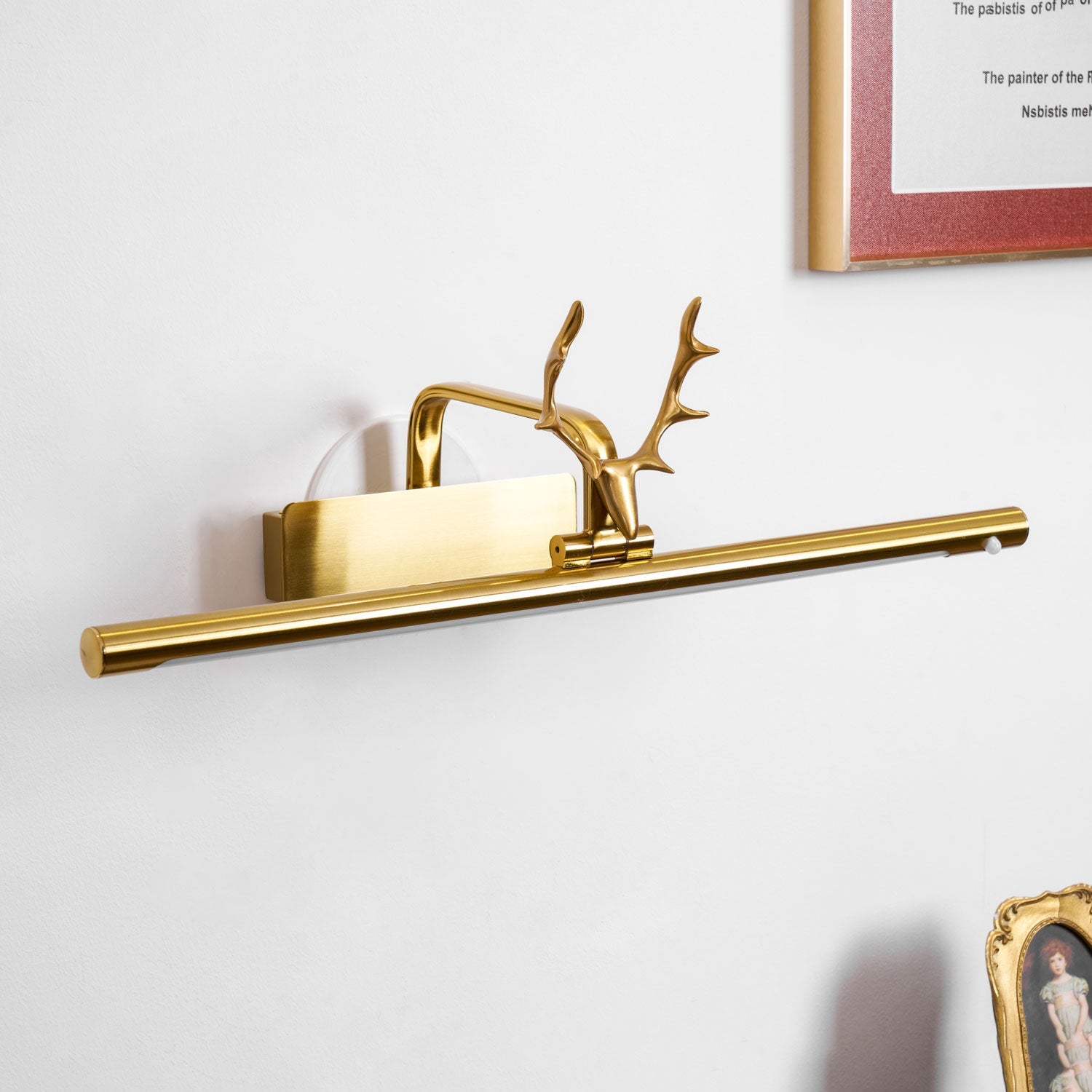 Metal wall sconce with stag horn accent and integrated LED glow