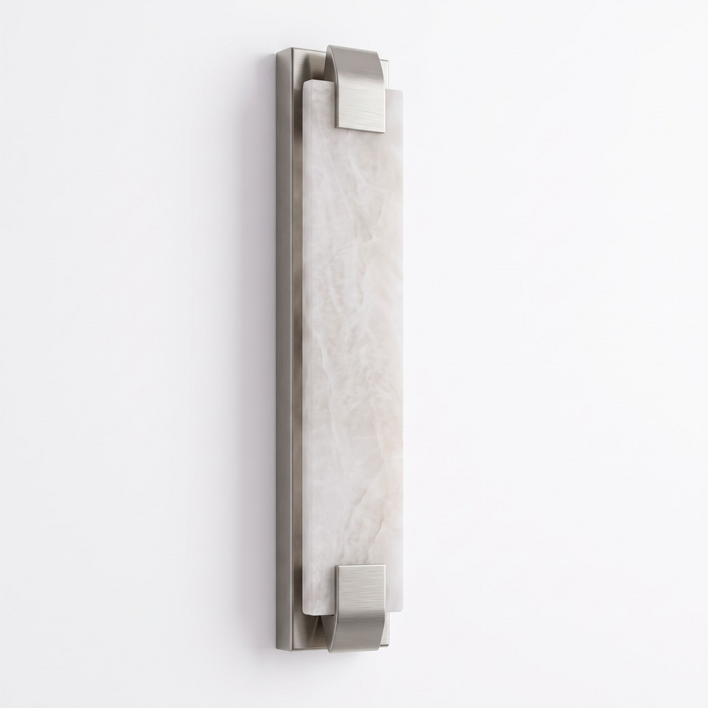 Studio shot of this Clérachic panel sconce in satin nickel finish, its alabaster panel glowing softly from within.