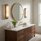 Flanking a round mirror in pairs, this Clérachic panel sconce in brass finish lights a subway-tile vanity.