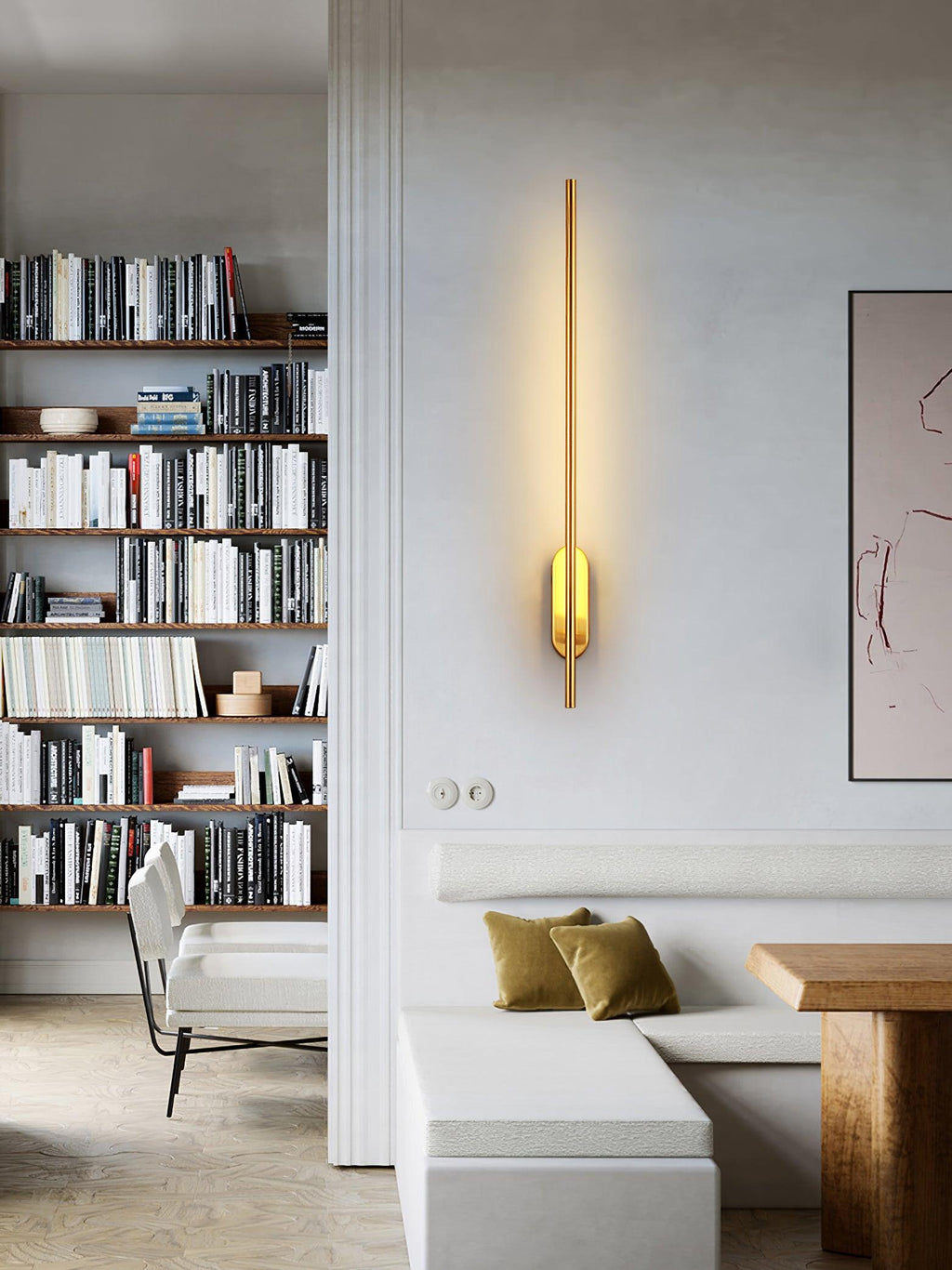 Linear brass wall sconce casting a refined upward glow