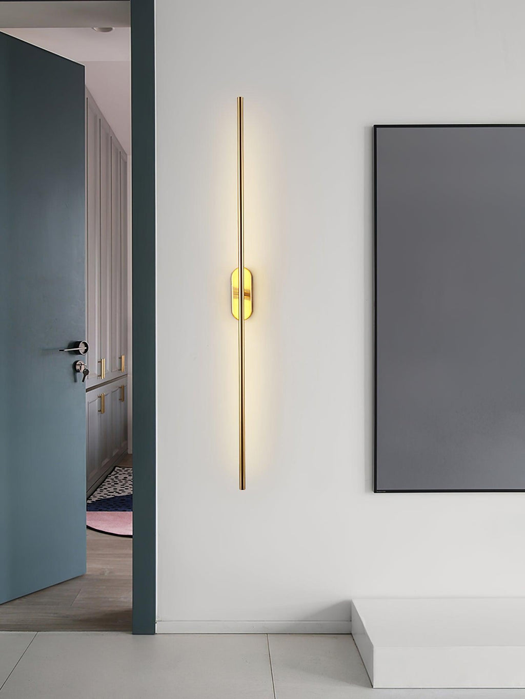 Slim linear wall sconce mounted neatly on a bedroom wall