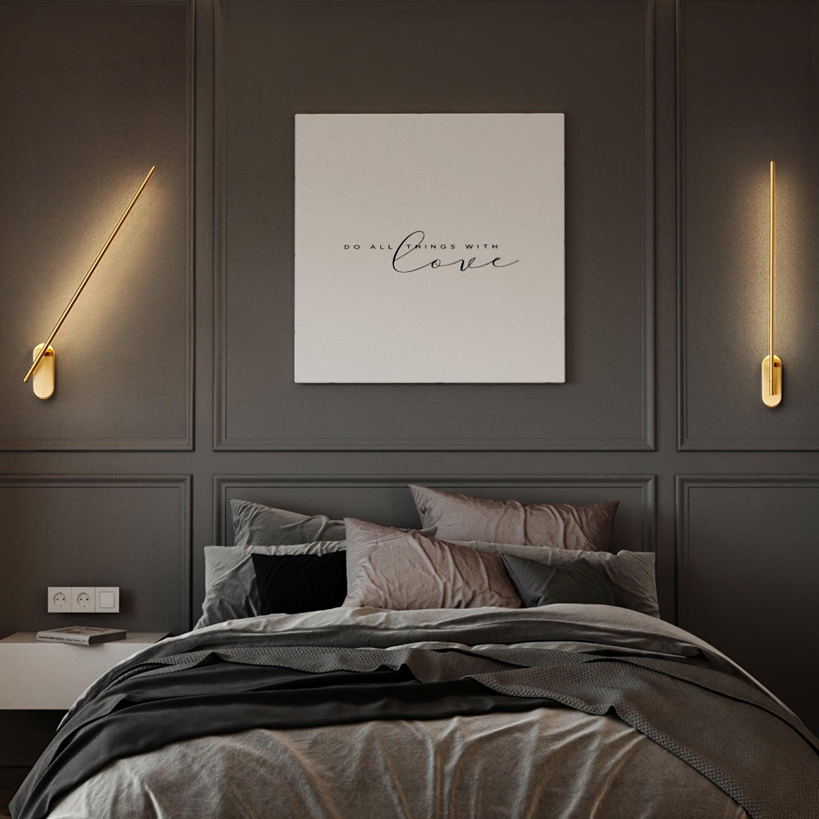 Linear metal wall sconce with soft vertical glow on a wall