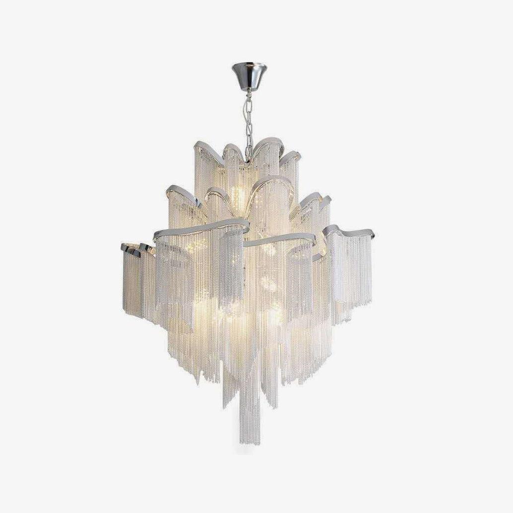 Scalloped tiers catch the light on this lit silver Clérachic chandelier, shown against a white backdrop.