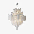 On a plain light backdrop, this lit silver Clérachic chandelier is shown fully tiered and glowing.