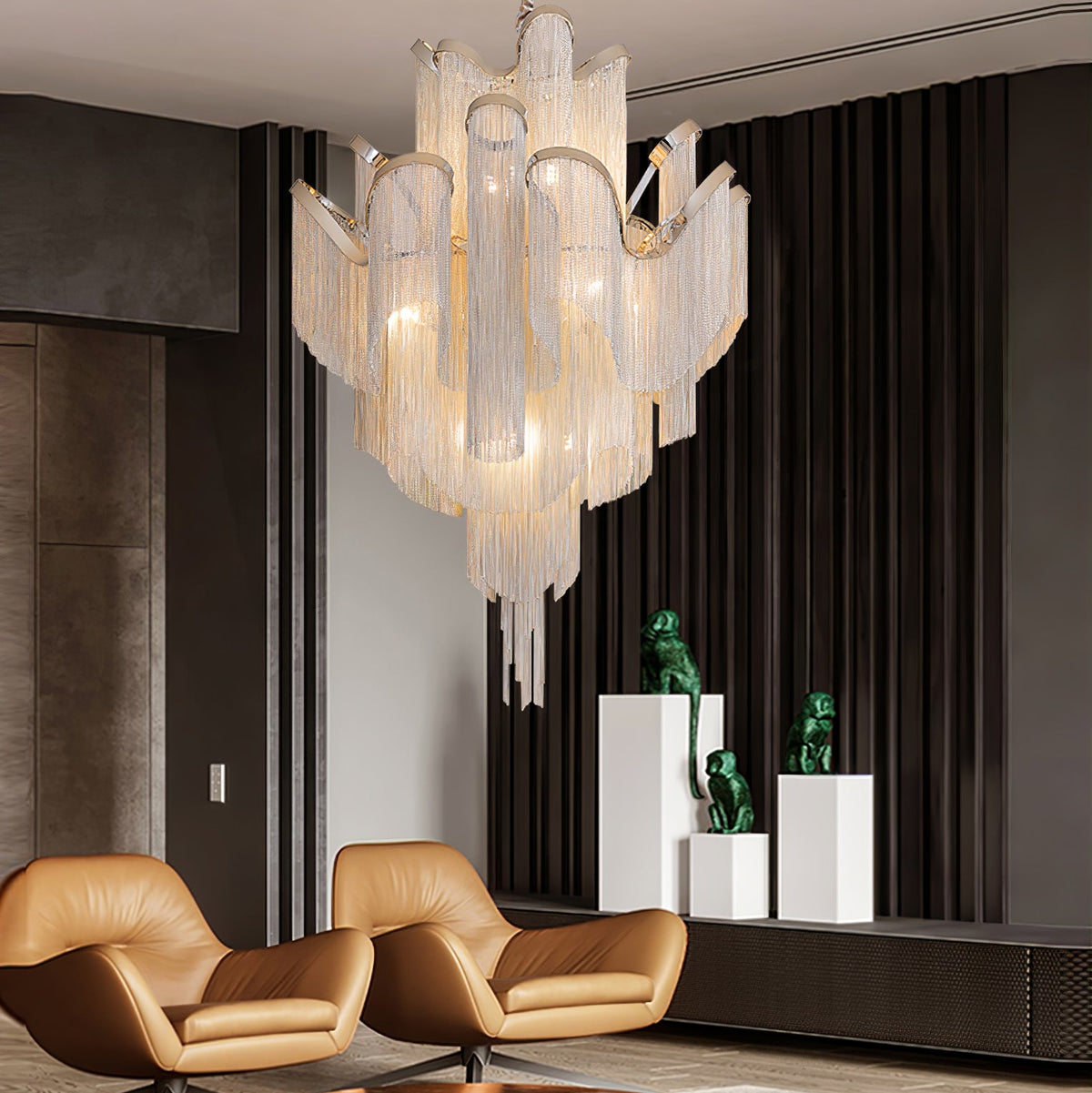 A silver Clérachic chandelier lights a dark hallway with tan leather chairs and small animal sculptures on plinths.