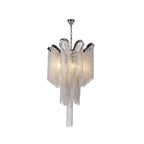 This silver Clérachic chandelier, lit, is shown tiered against a plain white backdrop.
