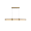 The same pendant shown straight on against white, its alabaster sections separated by slim brass collars.