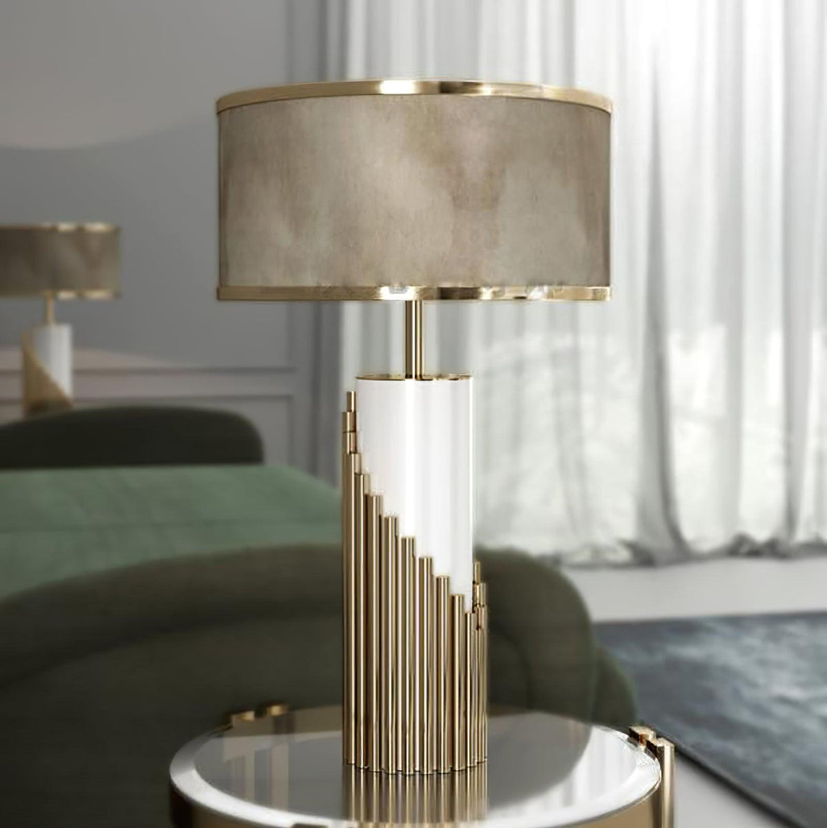 Beside a green sofa and sheer curtain, this Clérachic table lamp's gold ribbed base sits on a round mirrored side table.
