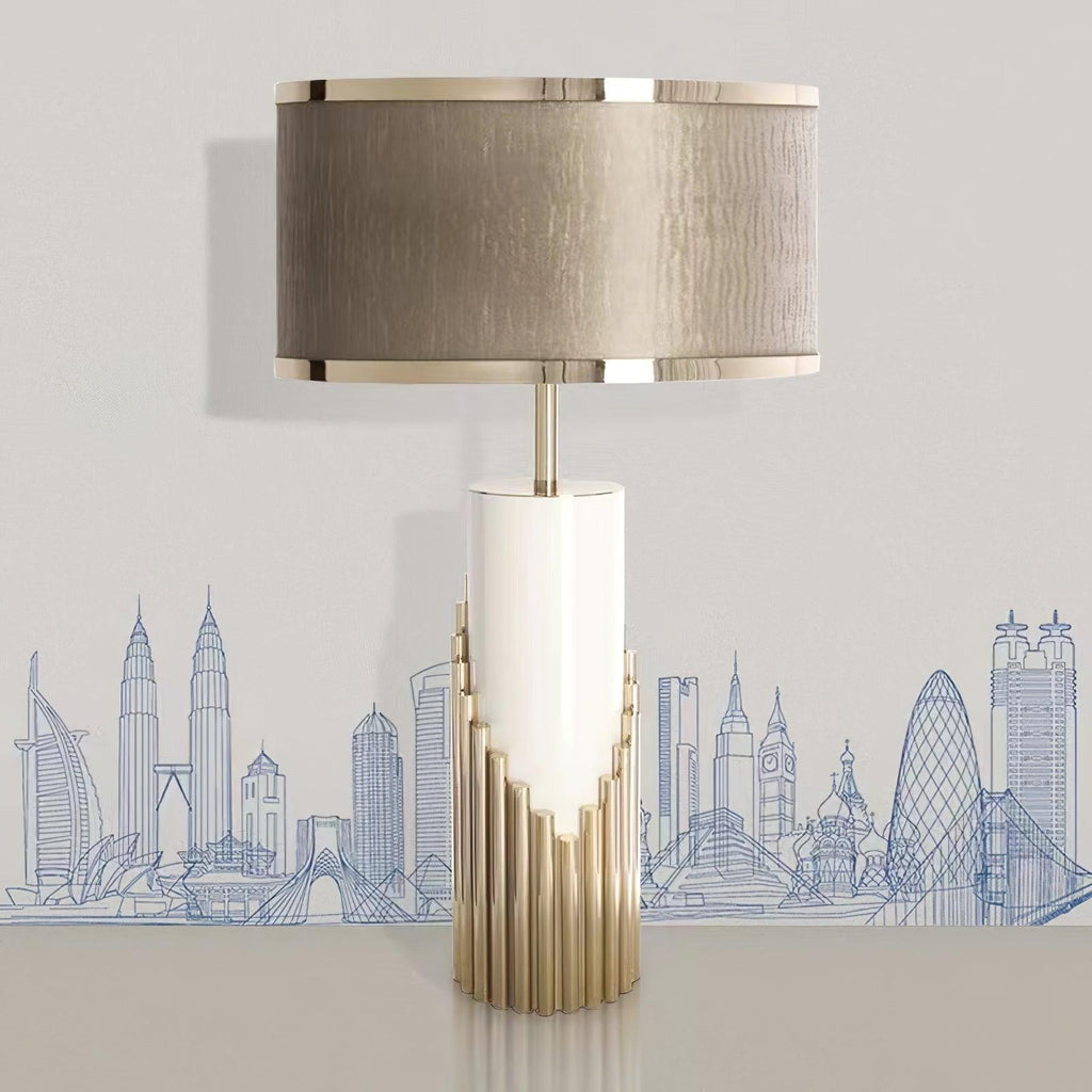 This Clérachic table lamp stands against wallpaper printed with a line-drawn city skyline, its shade catching soft light.