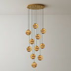 Twelve-light Sultana chandelier, alabaster globes cascading in a wide spiral from a gold ceiling plate.