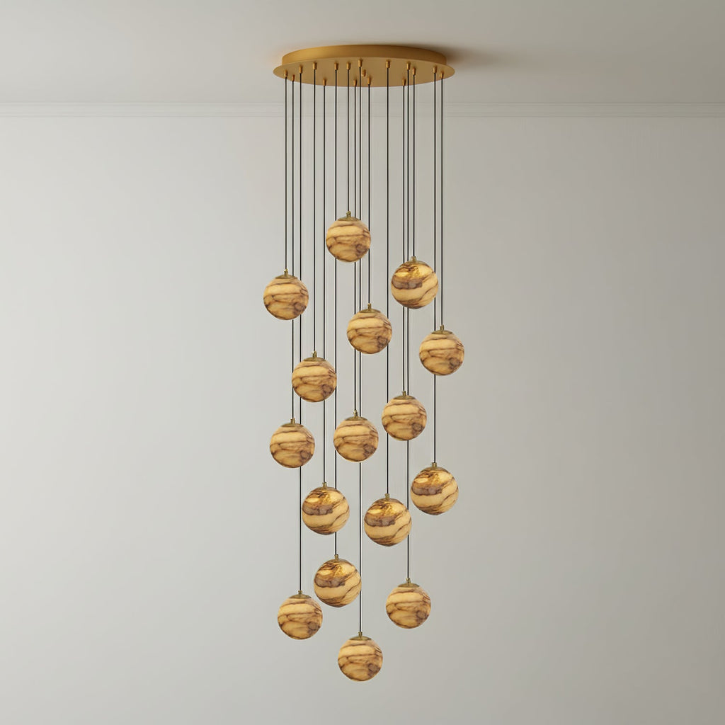 Sixteen lit alabaster globes on the Sultana chandelier, forming a taller and denser cascade.
