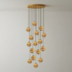 Sixteen lit alabaster globes on the Sultana chandelier, forming a taller and denser cascade.