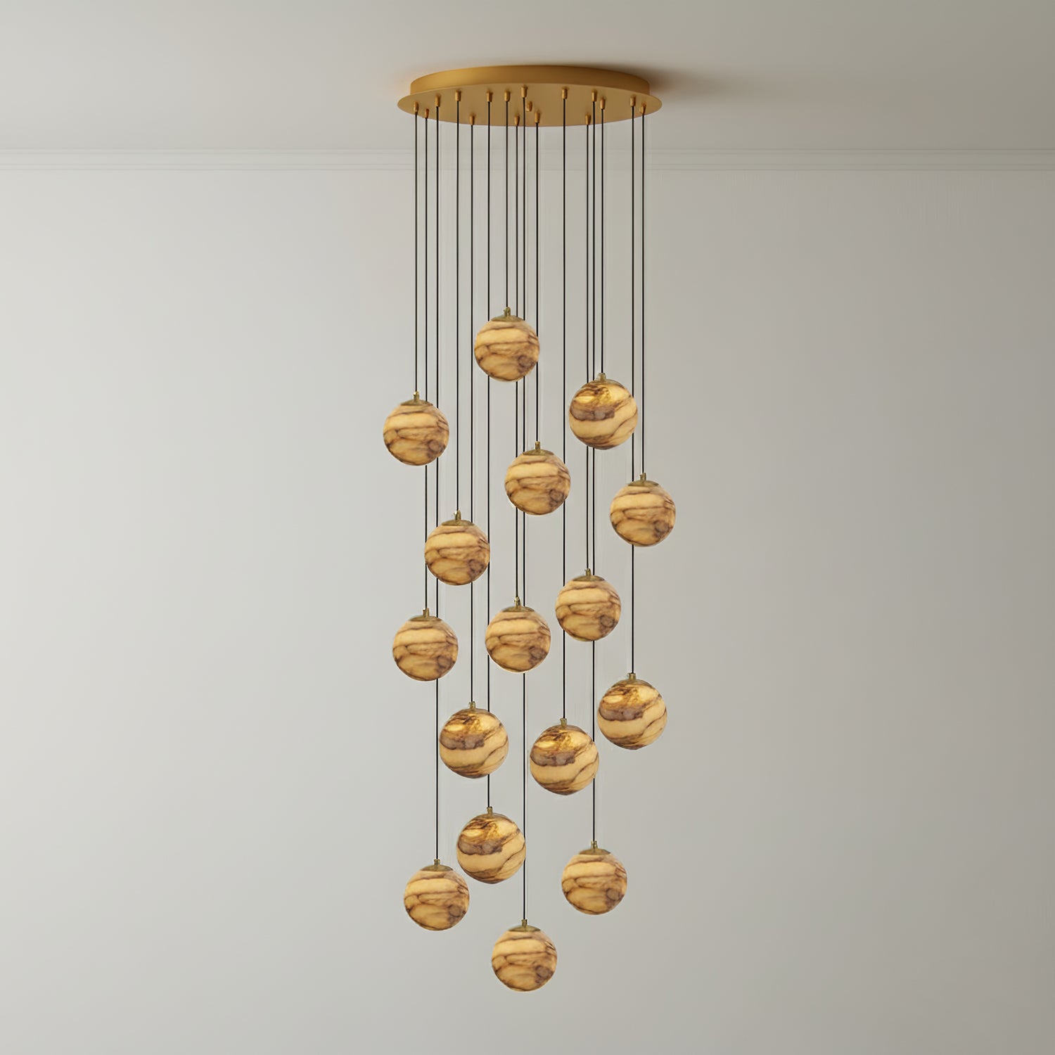 Sixteen lit alabaster globes on the Sultana chandelier, forming a taller and denser cascade.