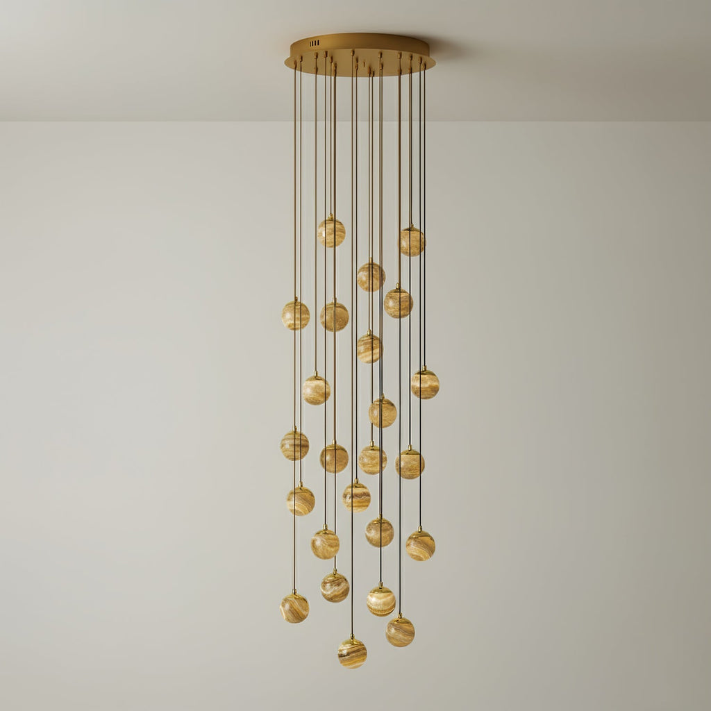 The twenty-one-light Sultana chandelier at full drop, globes falling in a deep column of warm light.