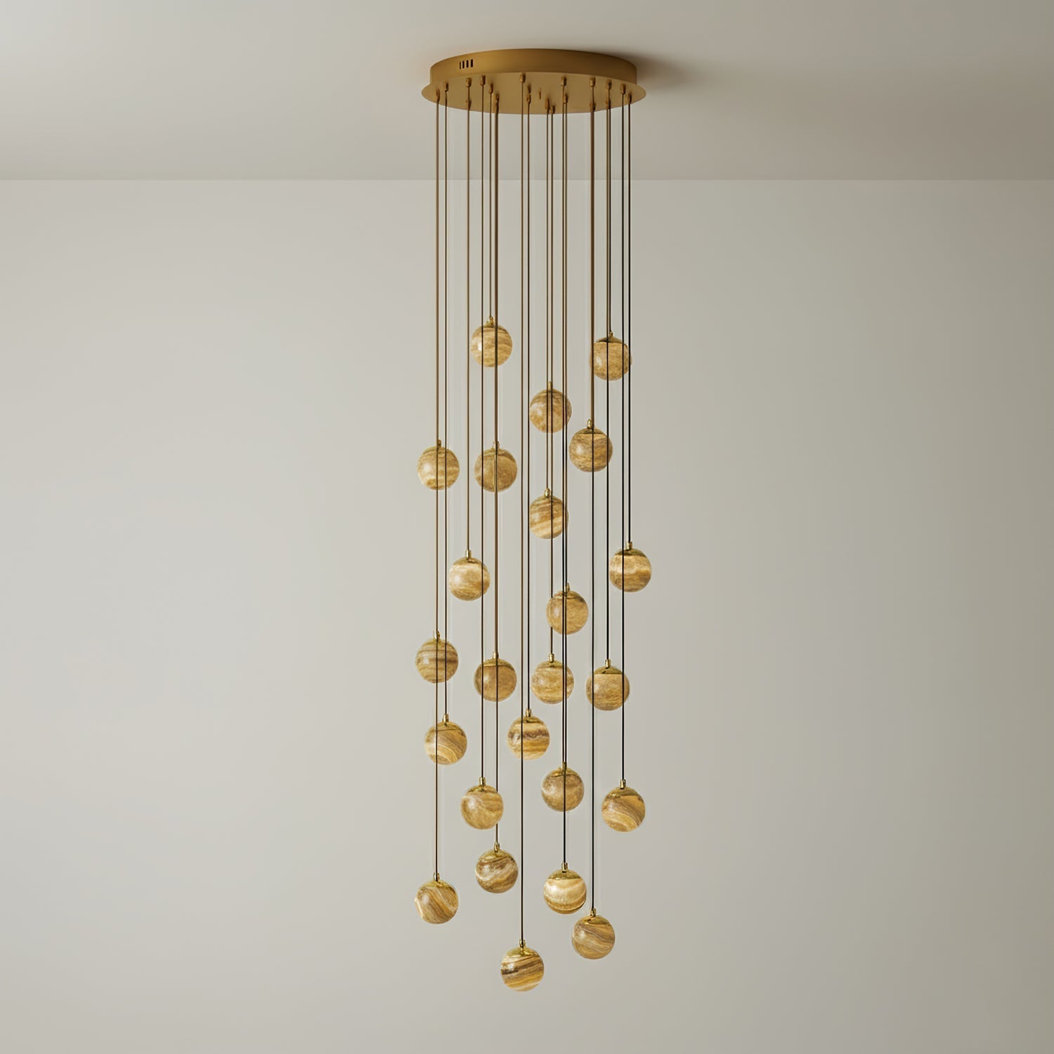 The twenty-one-light Sultana chandelier at full drop, globes falling in a deep column of warm light.