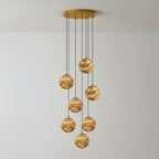 Seven-light version of the Sultana chandelier, its lit alabaster globes falling in a loose spiral.