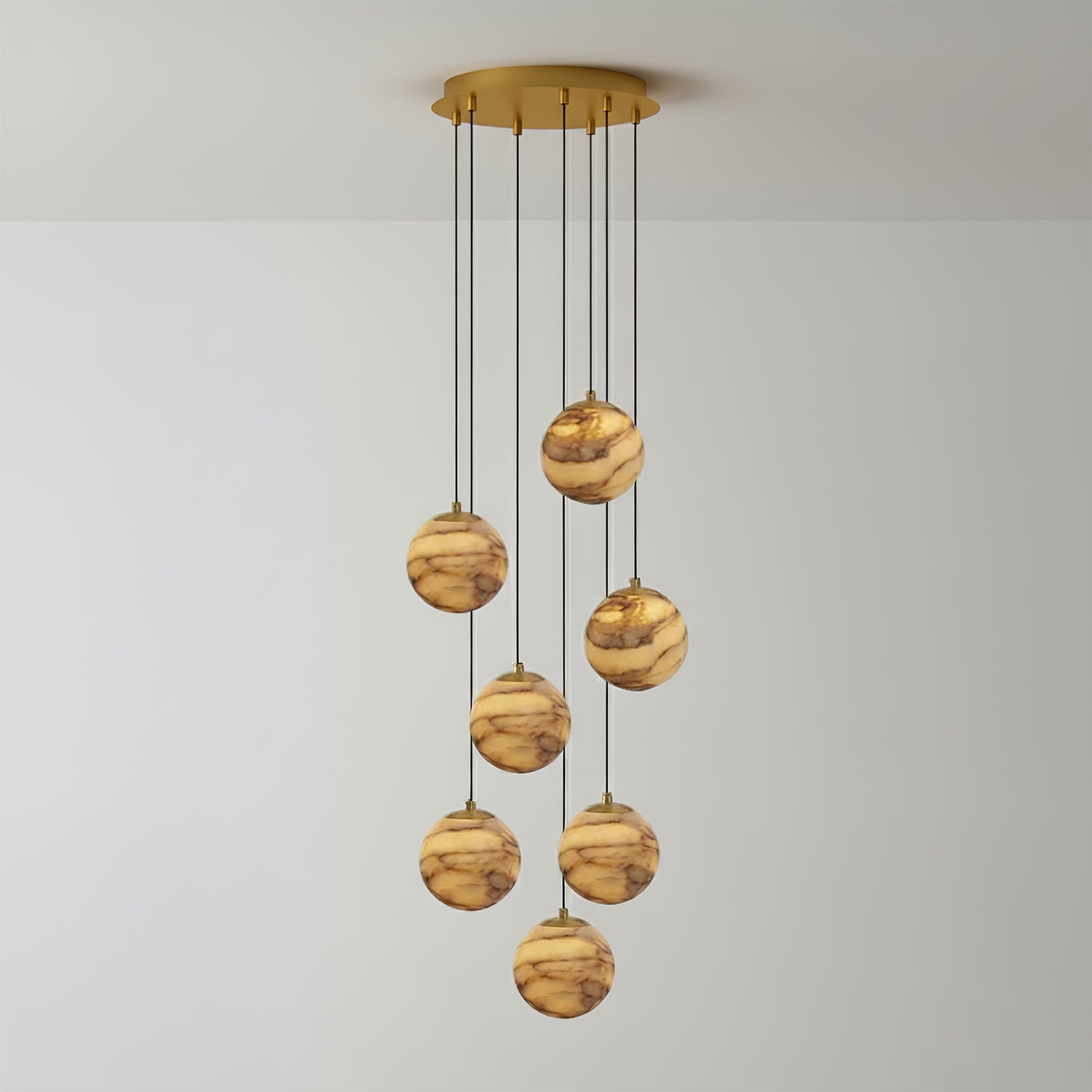 Seven-light version of the Sultana chandelier, its lit alabaster globes falling in a loose spiral.