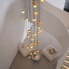 The Sultana chandelier seen from above, dropping through a curved stairwell to the lounge below.