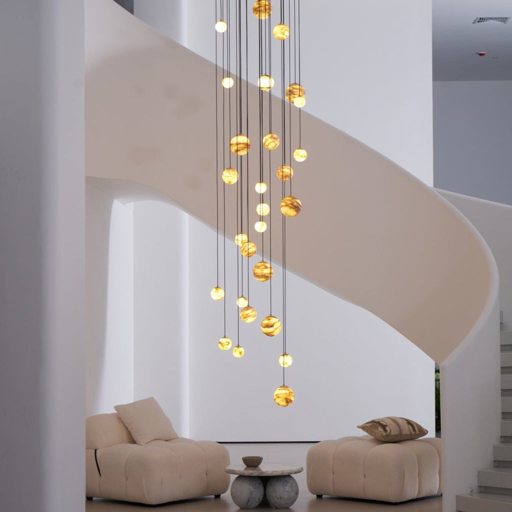 Close daylight view of the lit cascade, larger globes at the centre and smaller ones toward the edges.