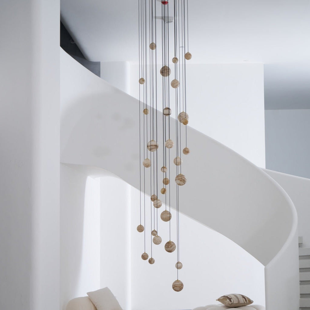 The Sultana chandelier switched off in daylight, the alabaster reading as soft cream and tan stone.