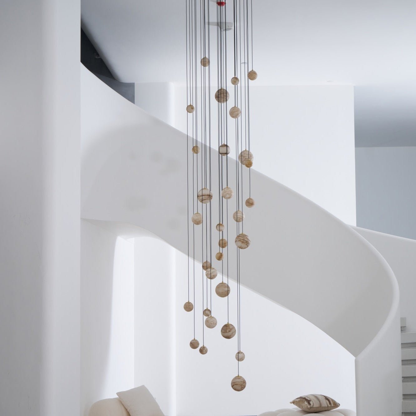 The Sultana chandelier switched off in daylight, the alabaster reading as soft cream and tan stone.