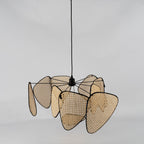 On a grey studio backdrop, this Clérachic pendant's black wire frame links each bamboo-weave paddle at a side angle.