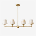 Alone against a plain backdrop, this Clérachic chandelier's straight bar and central sphere show in brushed brass.