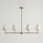 Seen straight-on against a plain background, this Clérachic chandelier's four cone shades sit in brushed nickel.