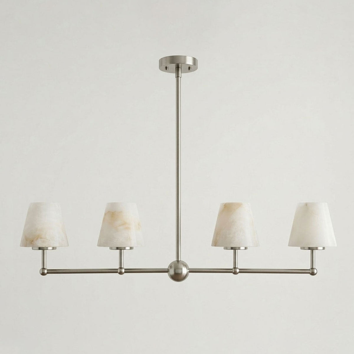 Seen straight-on against a plain background, this Clérachic chandelier's four cone shades sit in brushed nickel.