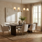 In a plaster-walled dining room with a jute rug, this Clérachic chandelier glows warm in brushed brass.