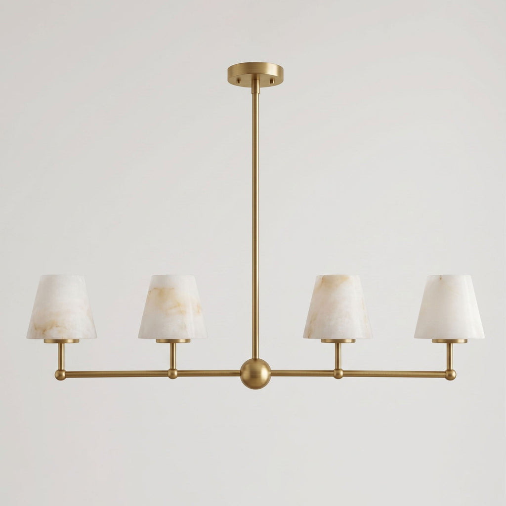 Against a plain backdrop, the sphere-bar frame of this Clérachic chandelier is shown here in brushed brass.