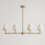 Against a plain backdrop, the sphere-bar frame of this Clérachic chandelier is shown here in brushed brass.