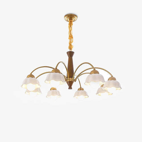 Midcentury brass chandelier with opaline ceramic shades lit warmly