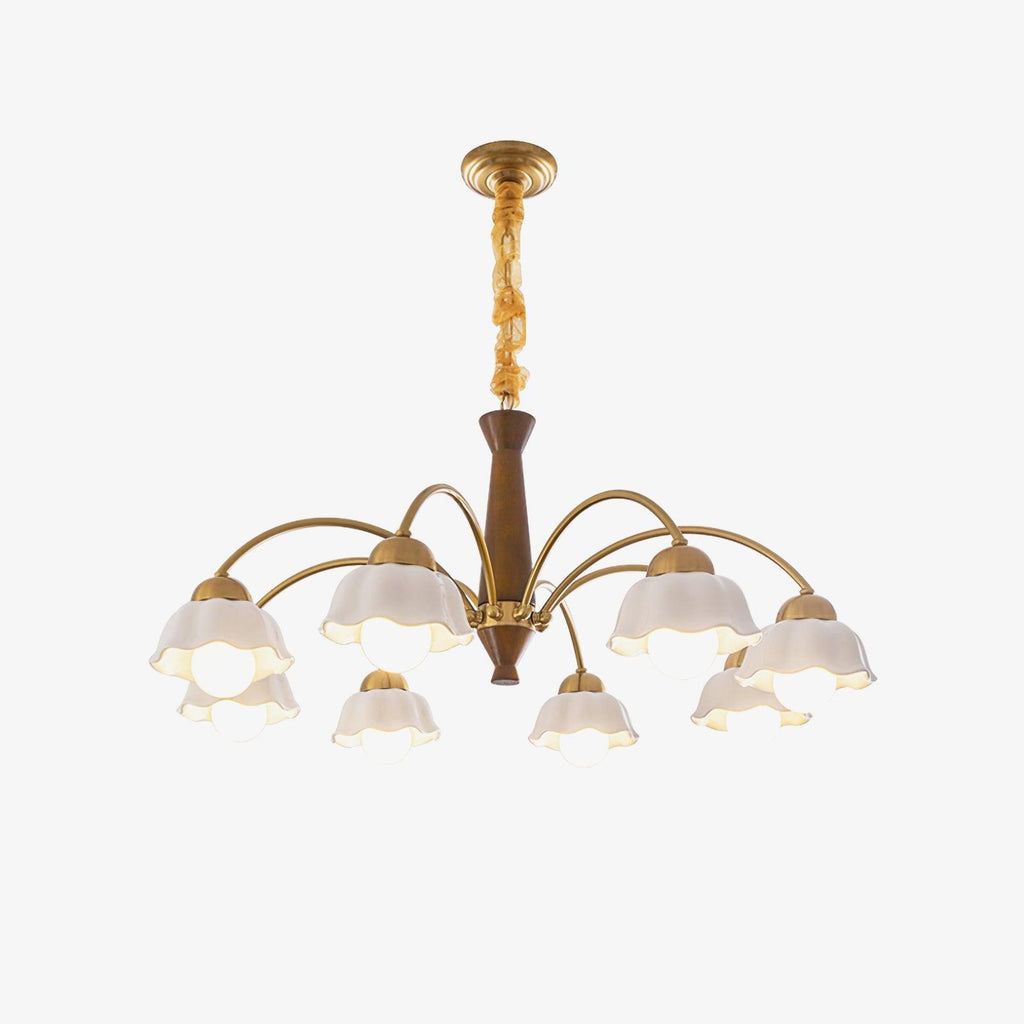 Brass chandelier with opaline shades over a midcentury dining table