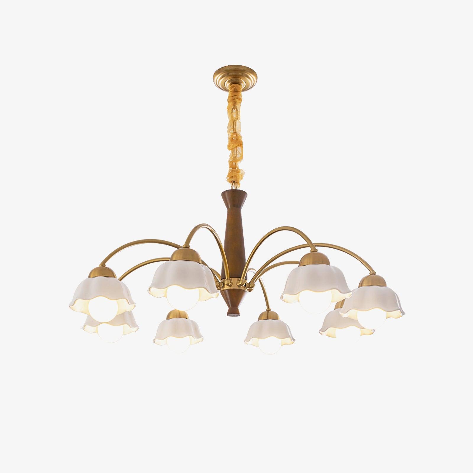 Brass chandelier with opaline shades over a midcentury dining table