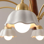 Brass and walnut chandelier with opaline shades glowing at dusk