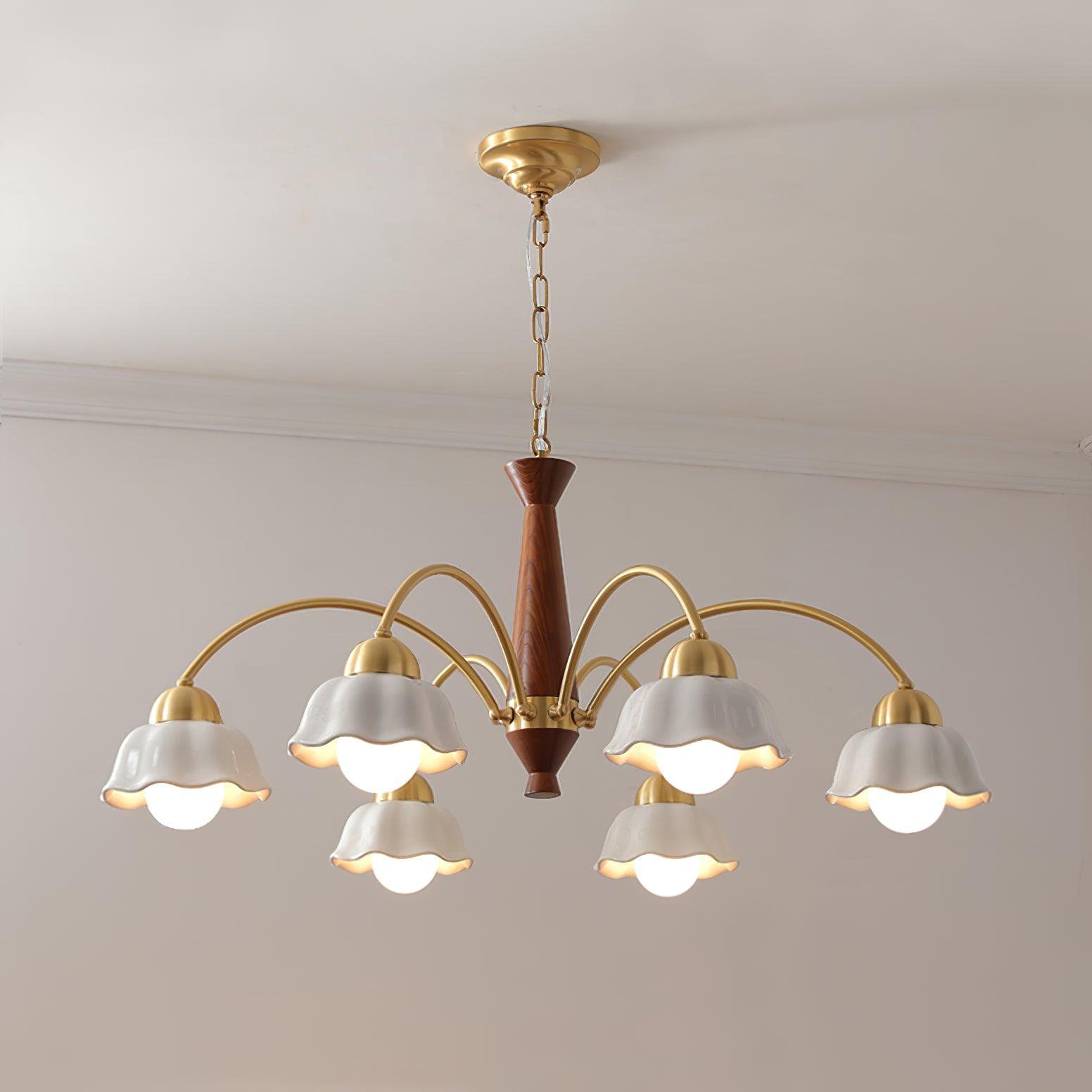 Walnut hub chandelier with radiating brass arms and ceramic shades
