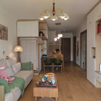 Walnut hub and brass arms holding white opaline ceramic shades