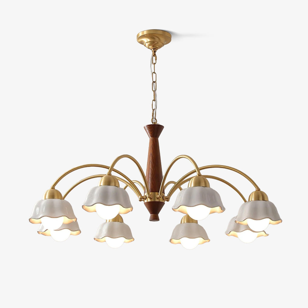 Swedish modern chandelier in brass and walnut against a pale ceiling