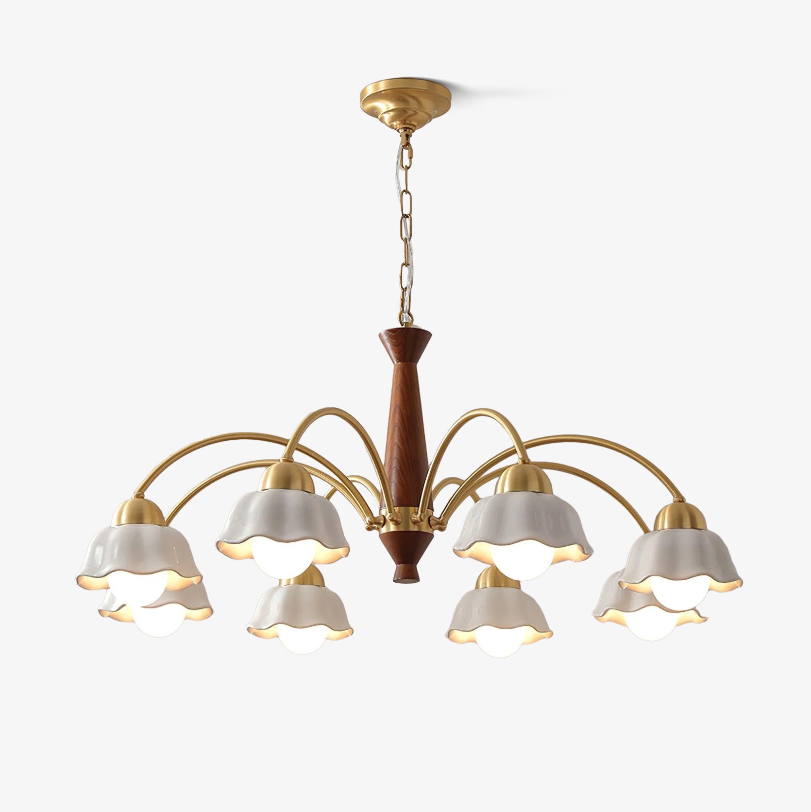 Swedish modern chandelier in brass and walnut against a pale ceiling